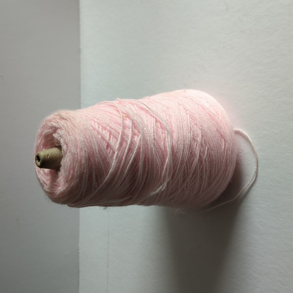 Big spool of 3 ply pink yarn